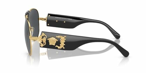 Black and gold designer sunglasses with ornate detailing.